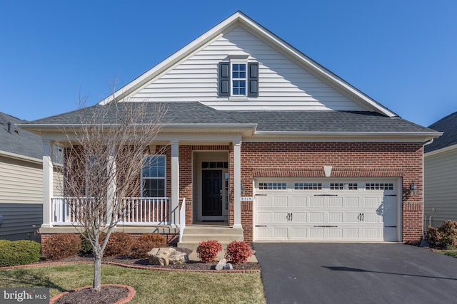 view of front of property with a porch, brick siding, a shingled roof, and a garage