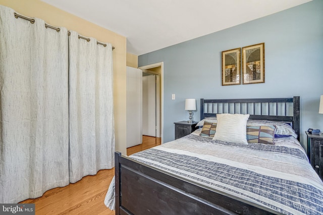 bedroom featuring wood finished floors