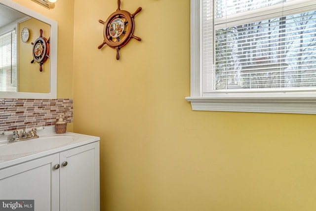 bathroom with vanity and backsplash