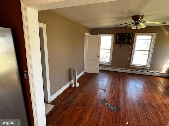 interior space with ceiling fan, a baseboard radiator, hardwood / wood-style flooring, and baseboards