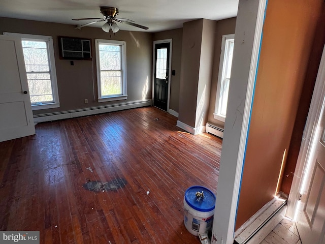 entrance foyer with a ceiling fan, baseboards, baseboard heating, and hardwood / wood-style flooring