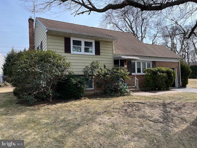 split level home with a chimney