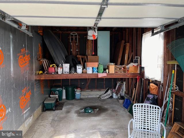 garage featuring wood walls