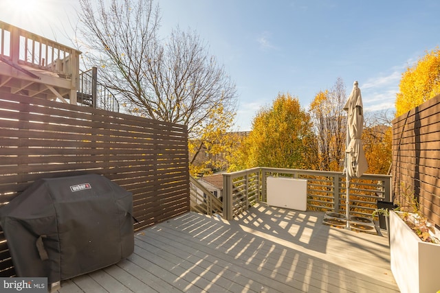 deck featuring fence and grilling area