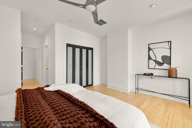 bedroom with recessed lighting, visible vents, light wood-style flooring, ceiling fan, and baseboards