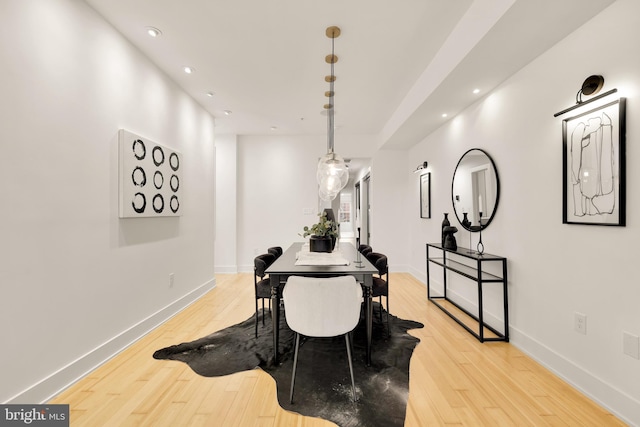 dining room featuring recessed lighting, baseboards, and light wood finished floors