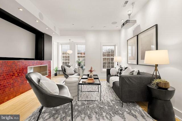 interior space with recessed lighting, visible vents, and wood finished floors