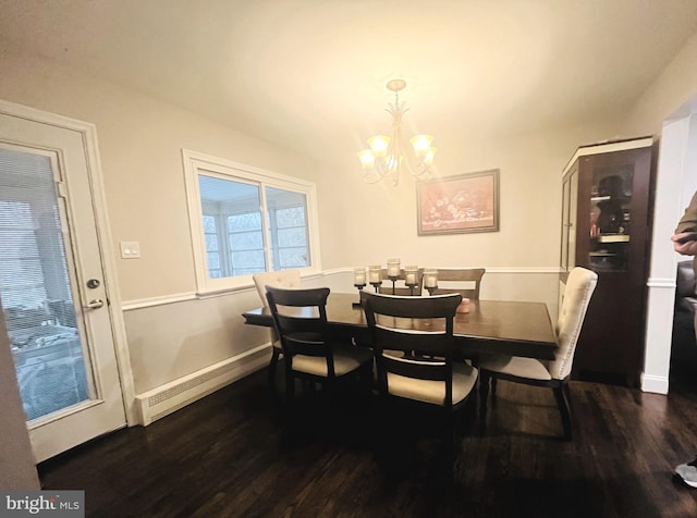 dining area featuring baseboards, an inviting chandelier, and wood finished floors