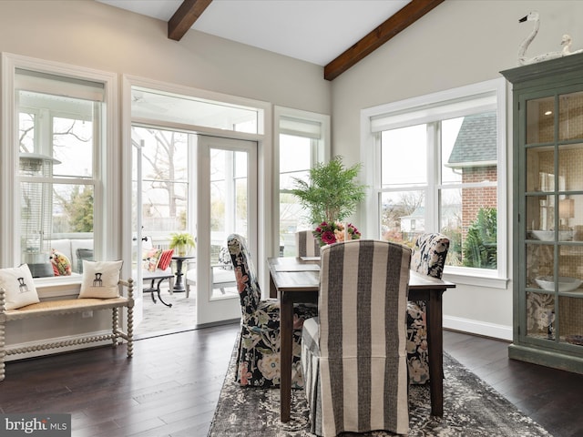 sunroom / solarium featuring lofted ceiling with beams