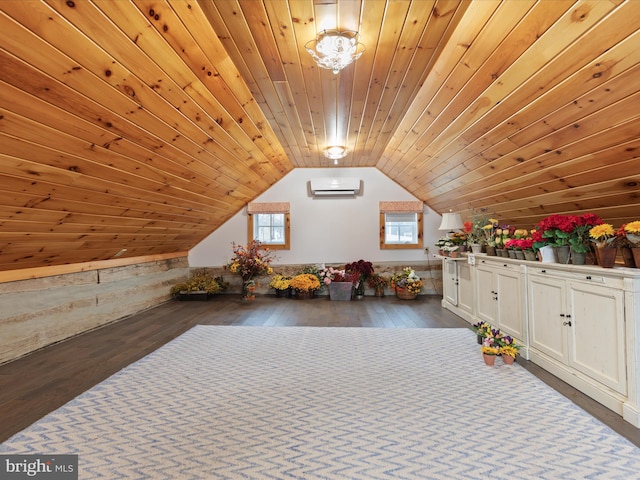 additional living space with wooden ceiling, vaulted ceiling, wood finished floors, and a wall mounted air conditioner