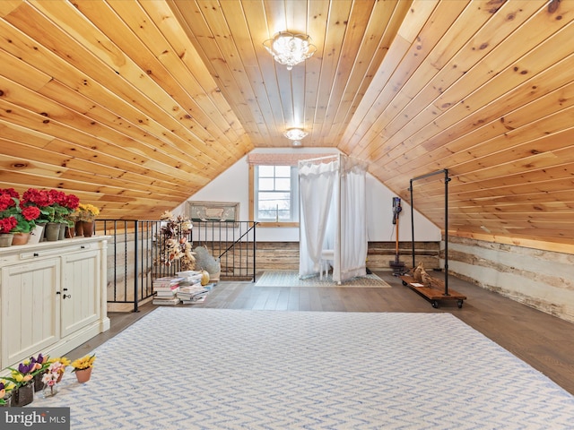 bonus room with lofted ceiling, wood ceiling, and wood finished floors