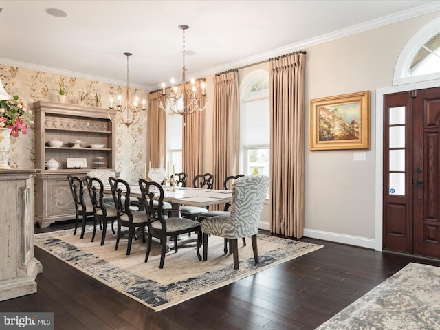 dining area featuring a healthy amount of sunlight, baseboards, ornamental molding, dark wood-style floors, and an inviting chandelier