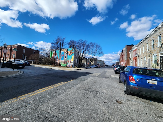 view of road with sidewalks and curbs