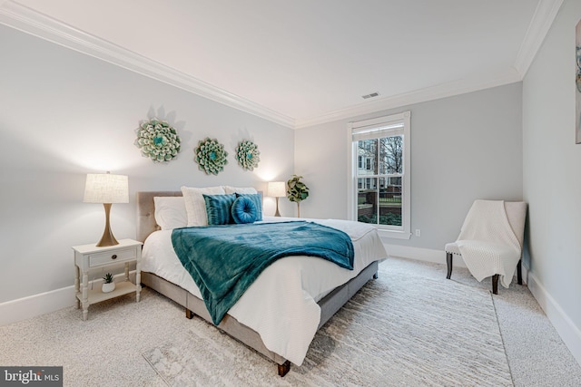 carpeted bedroom with ornamental molding, visible vents, and baseboards