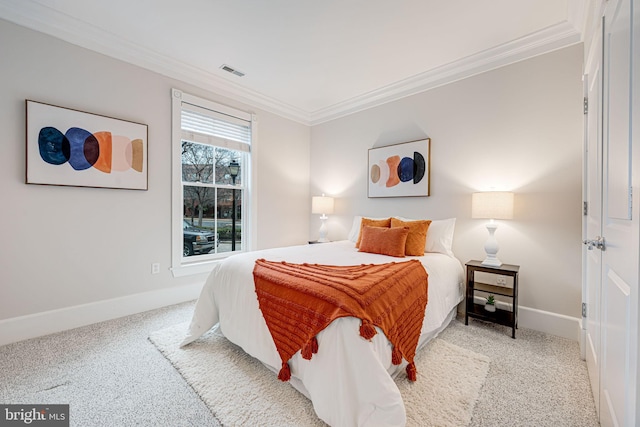 carpeted bedroom with ornamental molding, visible vents, and baseboards