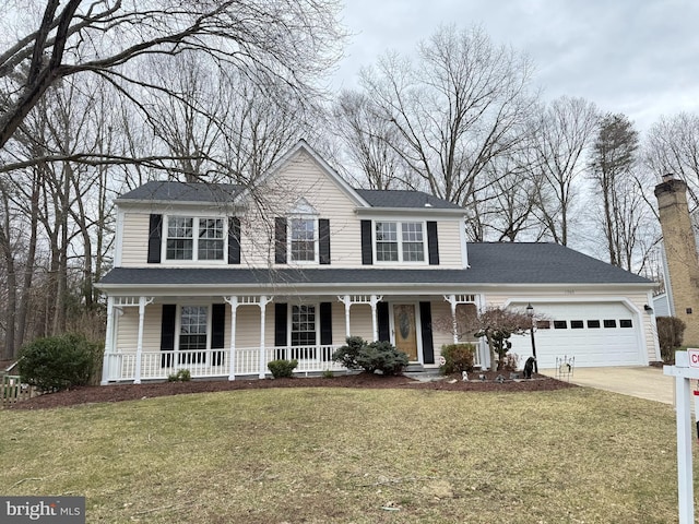 view of front of house featuring covered porch, driveway, a front yard, and an attached garage