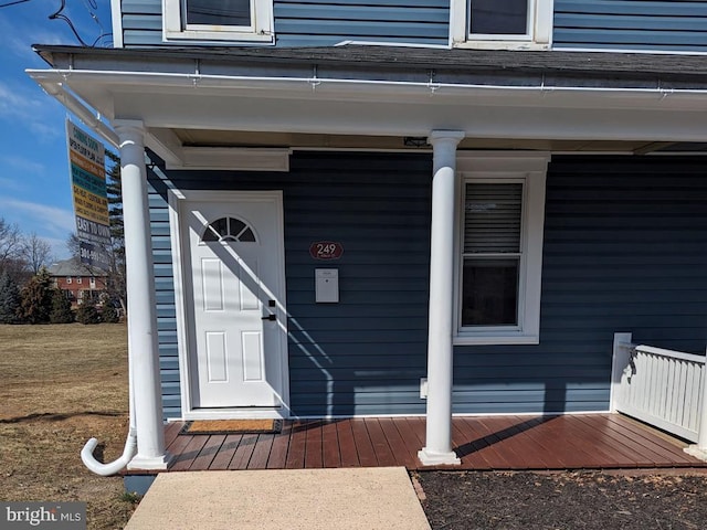 doorway to property featuring covered porch