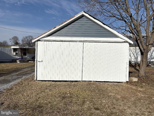 view of home's exterior featuring an outdoor structure