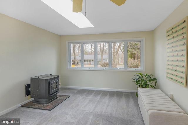 interior space featuring carpet, plenty of natural light, and ceiling fan