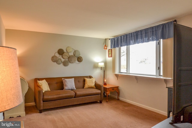 living room with carpet and baseboards