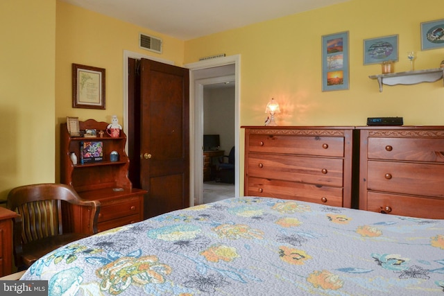 bedroom featuring visible vents