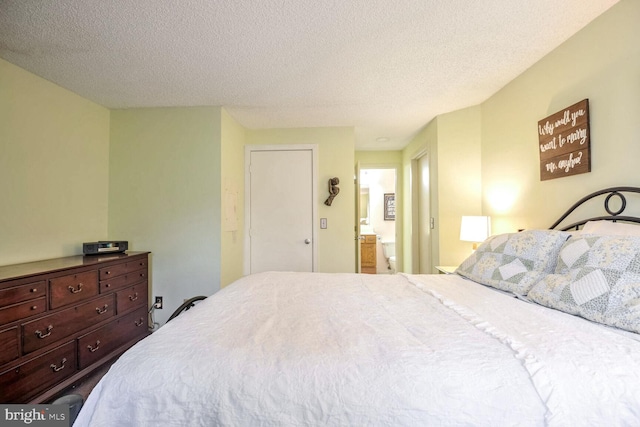 bedroom featuring a textured ceiling