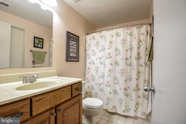 bathroom with visible vents, toilet, a shower with curtain, a textured ceiling, and vanity