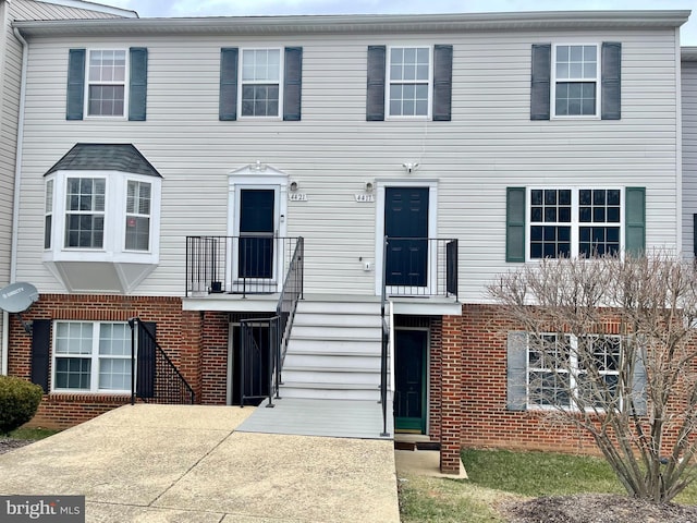 view of front of home with brick siding