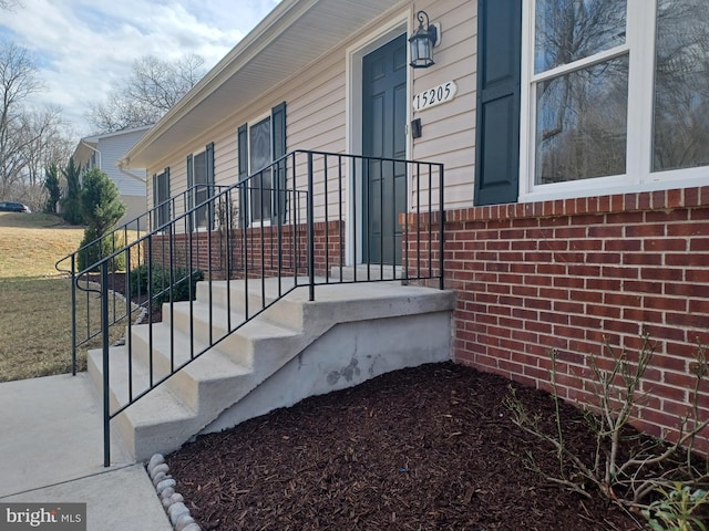 view of property exterior with brick siding