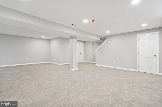 finished basement featuring baseboards, carpet floors, visible vents, and recessed lighting