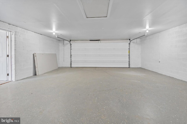 garage featuring concrete block wall