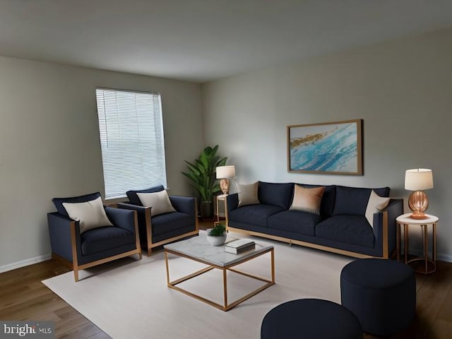 living room with wood finished floors and baseboards