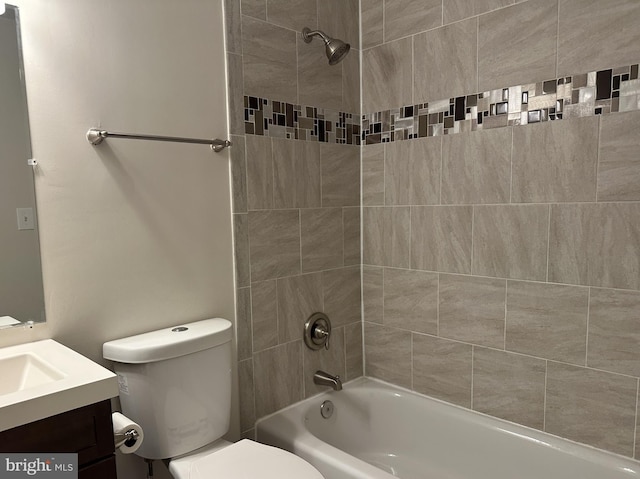 bathroom featuring toilet, tub / shower combination, and vanity