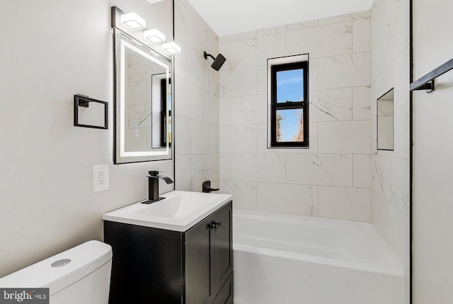 bathroom featuring toilet, bathing tub / shower combination, and vanity