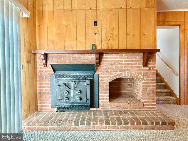 details featuring wood walls and carpet floors