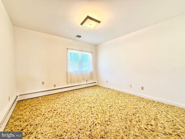 unfurnished room with visible vents, a baseboard heating unit, carpet flooring, baseboards, and baseboard heating