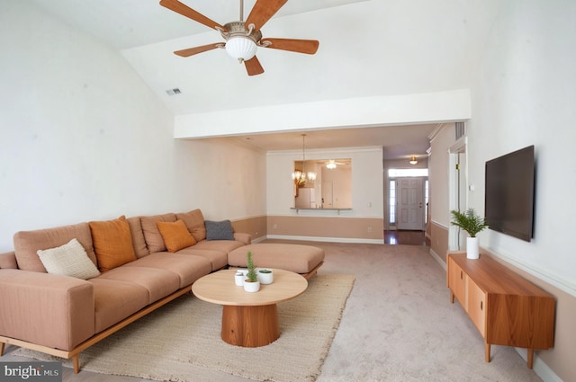 living area featuring vaulted ceiling, ceiling fan, visible vents, and light colored carpet