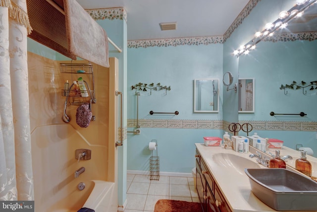 bathroom featuring tile patterned flooring, visible vents, shower / bath combination, double vanity, and a sink