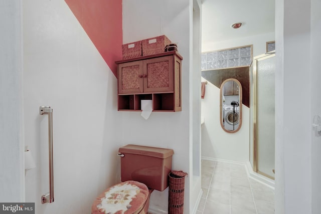 bathroom featuring tile patterned flooring and a shower stall