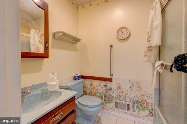 bathroom with visible vents, toilet, a shower with shower curtain, tile patterned floors, and vanity