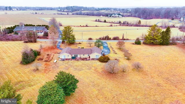 birds eye view of property with a rural view