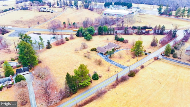 birds eye view of property with a rural view