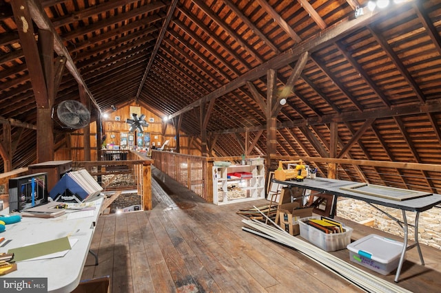 unfinished attic featuring an upstairs landing