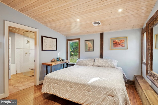 bedroom with lofted ceiling, visible vents, wood ceiling, wood finished floors, and baseboards