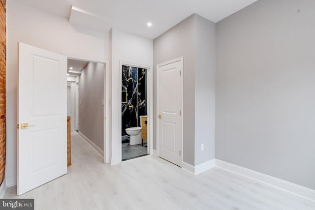 unfurnished bedroom with light wood-type flooring, recessed lighting, baseboards, and ensuite bathroom