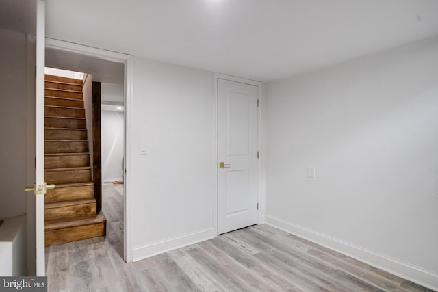 unfurnished bedroom featuring baseboards and light wood finished floors