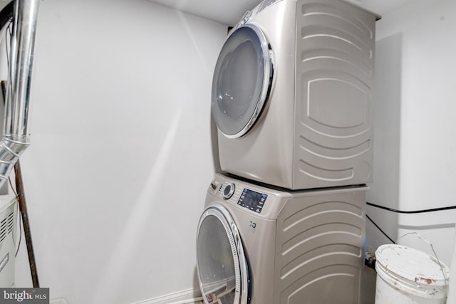 laundry room featuring stacked washer / dryer