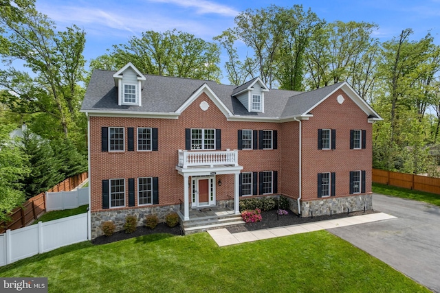 7911 Fort Hunt Rd, Alexandria, VA 22308 - georgian-style home with stone siding, brick siding, and roof with shingles