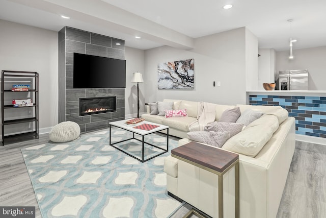 7911 Fort Hunt Rd, Alexandria, VA 22308 - living area featuring wood finished floors, recessed lighting, a fireplace, and baseboards
