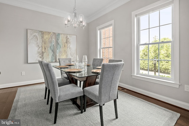 7911 Fort Hunt Rd, Alexandria, VA 22308 - dining space featuring a chandelier, wood finished floors, crown molding, and baseboards
